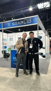 CGBT team with a visitor at the SOARLID booth in Warsaw