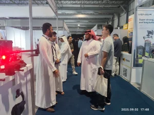 Visitors discussing drone technology at SADEX 2025