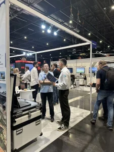 Visitors talking with the CGBT team at UAV Show 2026